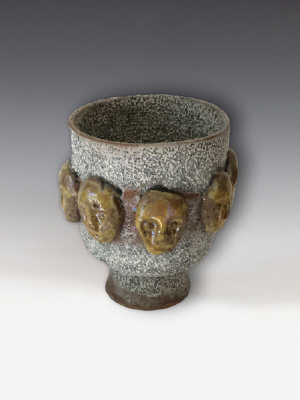 Artist: Beatrice Wood, Title: Lava Glazed Footed Bowl with Rings of Gold Masks, c. 1994 - click for larger image