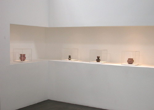 Artist: George Ohr, Title: Installation view of George E. Ohr: Mad Potter of Biloxi and Frank Gehry: Ohr-O'Keefe Museum exhibition at the Frank Lloyd Gallery in 2003. - click for larger image