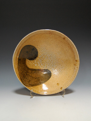 Artist: Robert Brady, Title: Bowl, amber with black swoosh - click for larger image